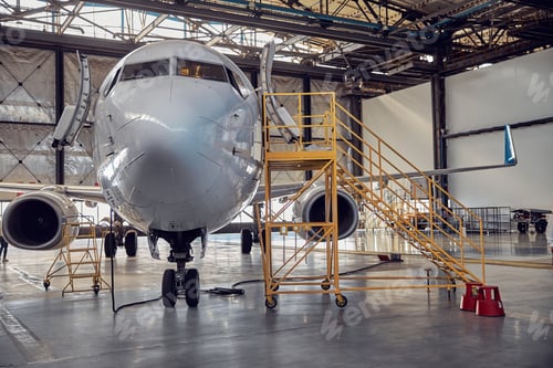 Preview: Airplane at parking apron in the aviation hangar