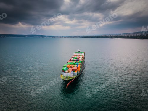 Preview: A loaded container ship in the sea, aerial view, concept of international trade and shipping