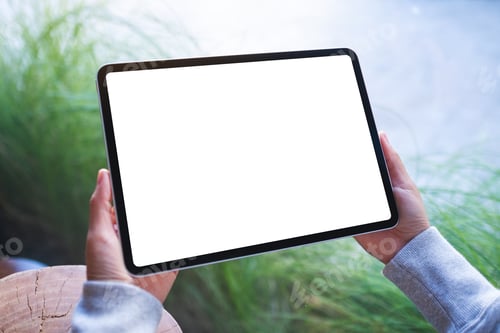 Preview: Mockup image of a woman holding digital tablet with blank white desktop screen
