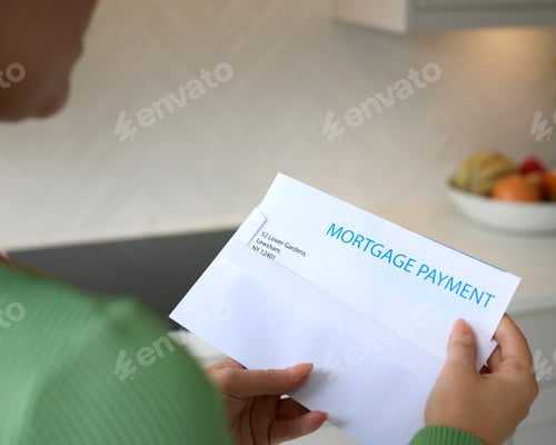 Preview: Close Up Of Woman Opening Letter About Increase Repayment On Mortgage During Cost Of Living Crisis