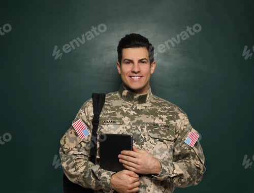 Preview: Cadet with backpack and tablet near chalkboard. Military education