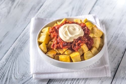 Preview: Portion of patatas bravas with sauces