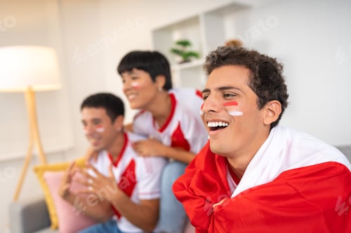 Preview: Three friends cheering for their team watching a soccer game