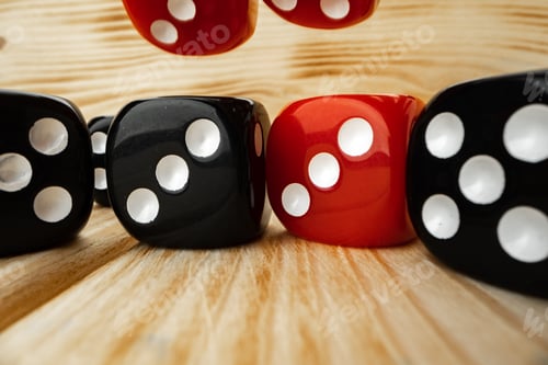 Preview: Red and black dice cubes on wooden background