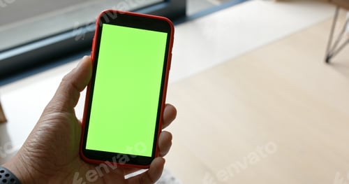 Preview: Man hold with green screen on cellphone