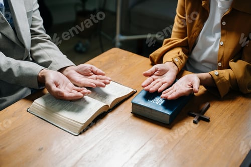 Preview: Two people reading and study bible in home and pray together.Studying the Word Of God