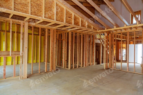 Preview: New residential construction home framing against a wooden construction