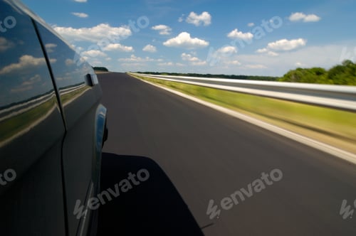 Preview: Side view of a car view is a smooth highway