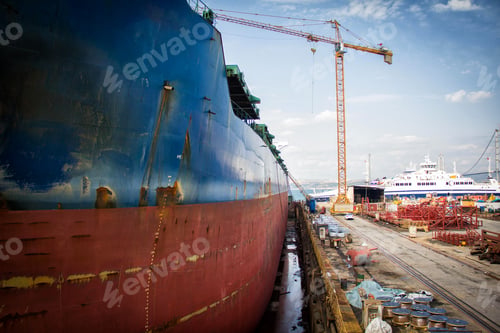Preview: A large tanker cargo ship is being renovated and painted in shipyard dry dock