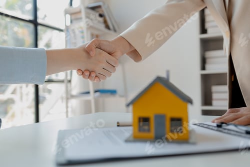 Preview: real estate broker manager hand shake to customer after signing contract for buying house, investmen
