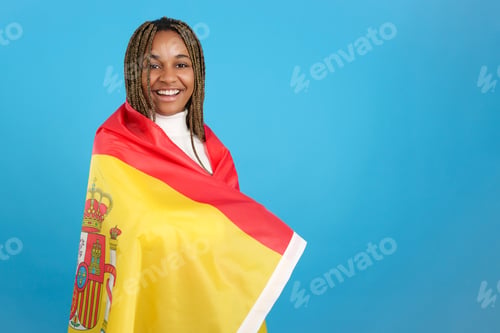 Preview: African woman wrapped in a spanish national flag