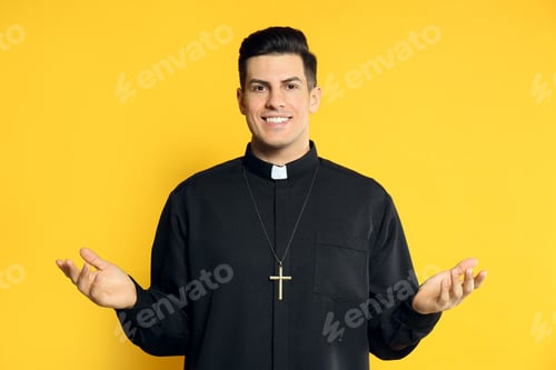 Preview: Priest wearing cassock with clerical collar on yellow background
