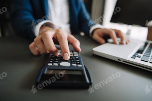Preview: Women counting coins on calculator taking from the piggy bank. hand working on calculator