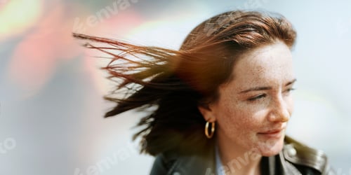 Preview: Happy woman enjoying the breeze