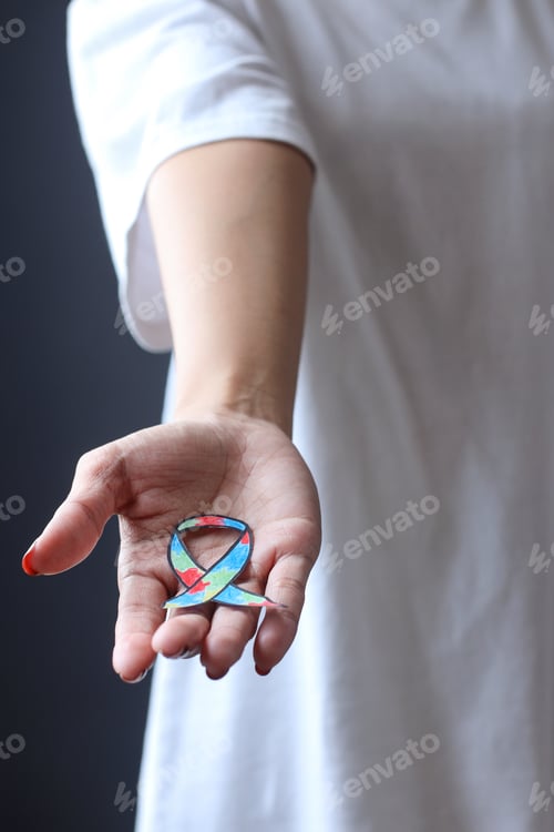 Preview: Close-up palm showing colorful autism ribbon shape
