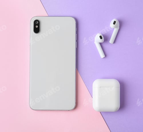 Preview: Wireless earphones, mobile phone and charging case on color background, flat lay