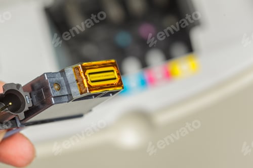 Preview: Printer cartridge replacement process at a workspace in the afternoon