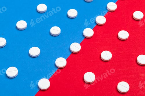 Preview: White medical pills on a two color red and blue background