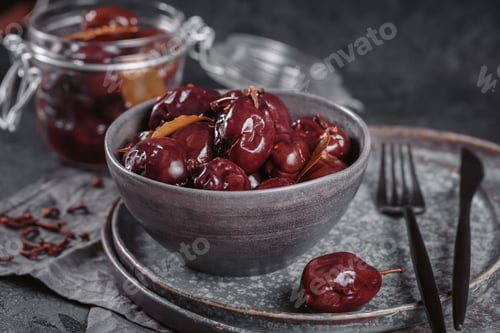 Preview: Bowl of pickled plums with spices