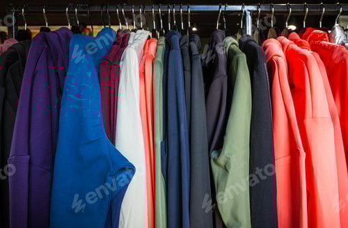 Preview: Colorful Collection of Hoodies on Display in Retail Store