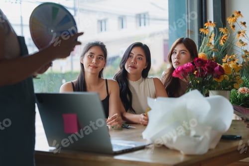 Preview: Women learning floral design during creative workshop