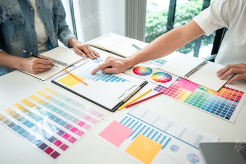 Preview: Team of creative graphic designer working on color swatch samples chart for selection coloring