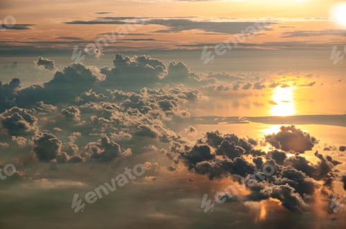Preview: Golden Sky Above Clouds at Sunrise or Sunset