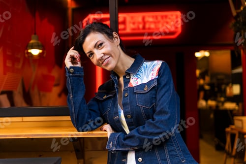 Preview: Stylish Woman Posing with Denim Jacket in City