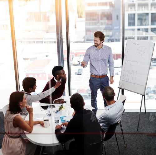 Preview: Shot of a businessman giving a whiteboard presentation to a group of colleagues in a boardroom