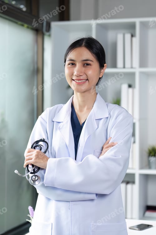 Preview: Confident Female Doctor in White Coat with Stethoscope in Modern Medical Office Setting