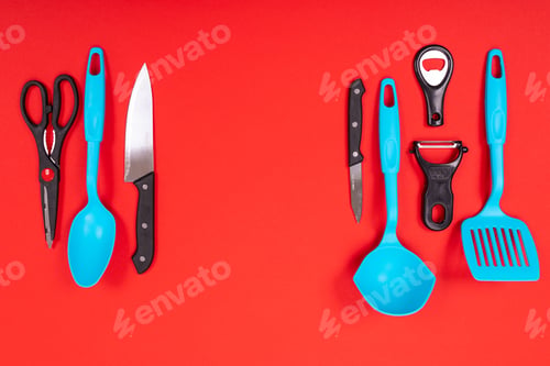 Preview: top view of stylish kitchen utensils isolated on red background