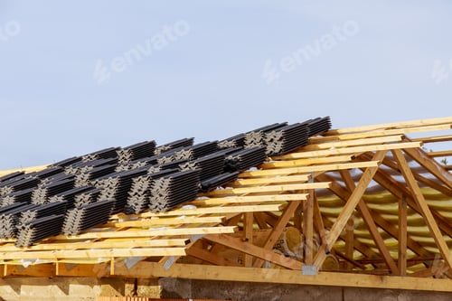 Preview: Top view, wooden roof structure of frame beams of the farm house, metal tiles.