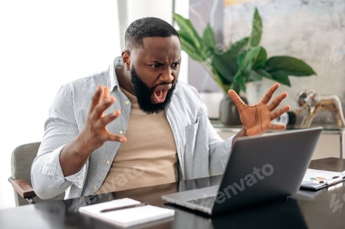 Preview: Irritated angry african american man, company worker, freelancer, ceo company, sitting at a desk in