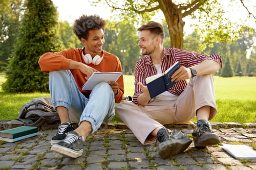 Preview: Two friend students talking together discussing ideas