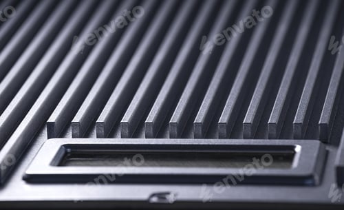 Preview: Fluted metal surface next to a control panel