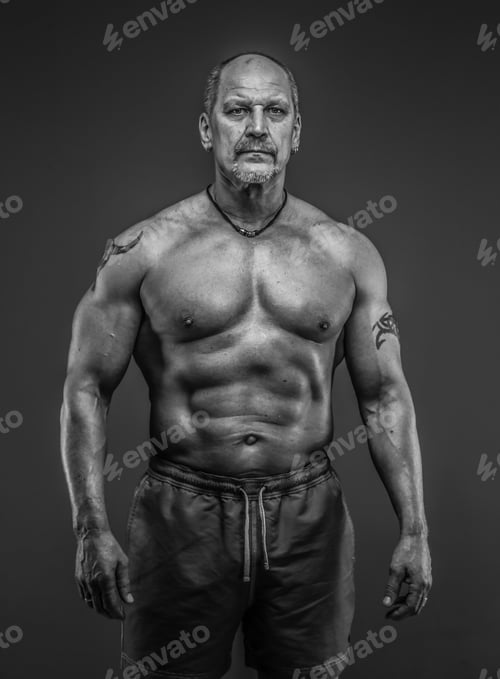 Preview: male with muscular body posing in studio