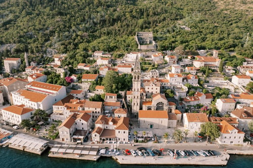Preview: Parking lot on the embankment overlooking the Church of St. Nicholas. Perast, Montenegro. Drone