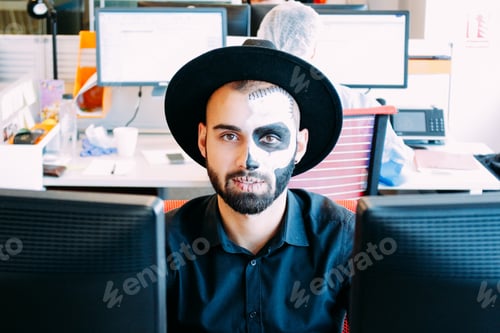 Preview: Halloween at the office. Man costumed as skeleton