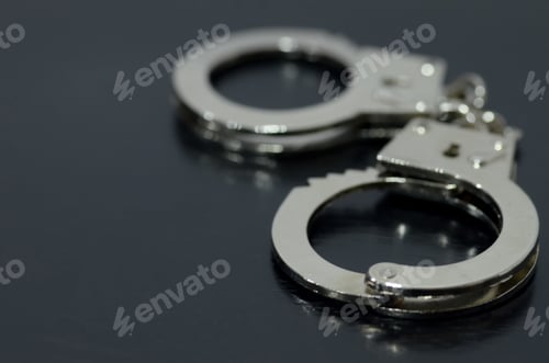 Preview: The handcuffs are a symbol of restraint and confinement