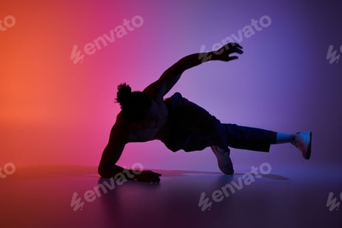 Preview: African american dancer in a colorful studio