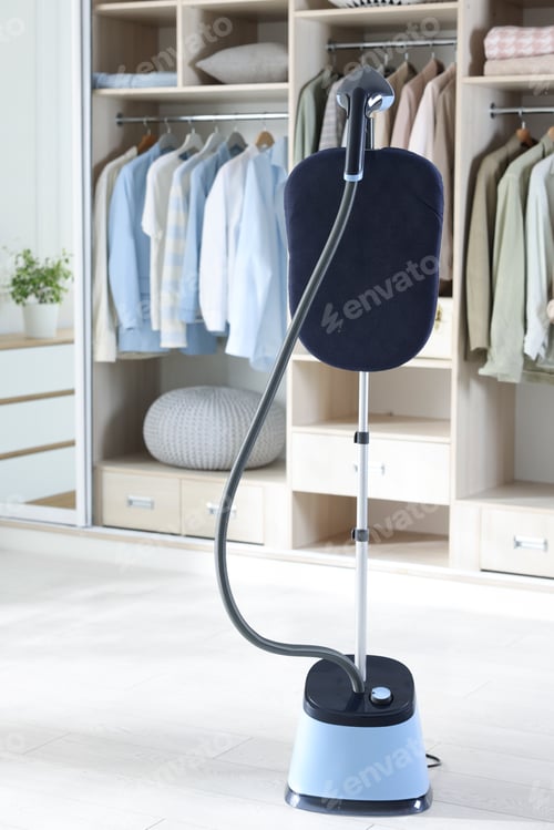 Preview: Modern upright steamer with stand and wardrobe indoors