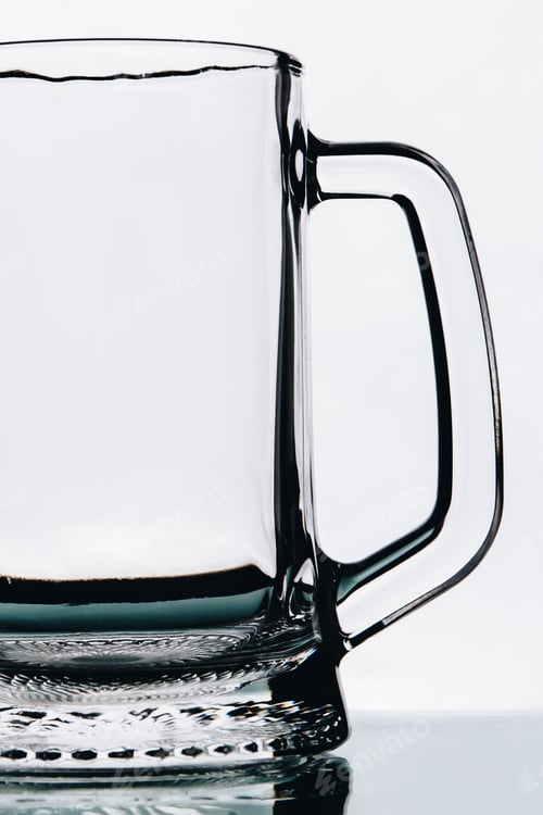 Preview: Empty beer glass with handle on white background.