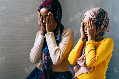 Preview: Hands of muslim people praying during islamic religious prayer