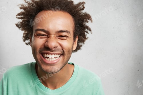 Preview: People, happiness and pleasant emotions concept. Cheerful overjoyed young man with Afro hairstyle an