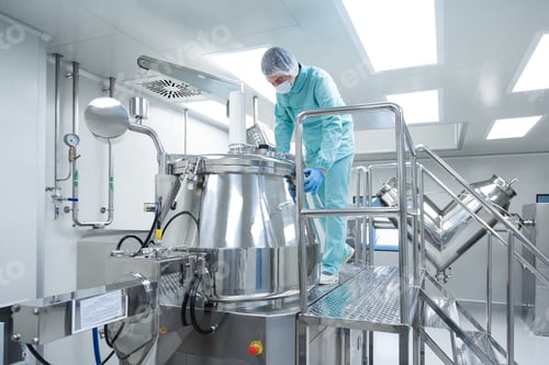 Preview: Pharmaceutical factory man worker in protective clothing operate production line in sterile working