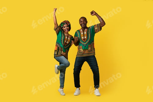 Preview: Emotional african spouses in traditional costumes celebrating success
