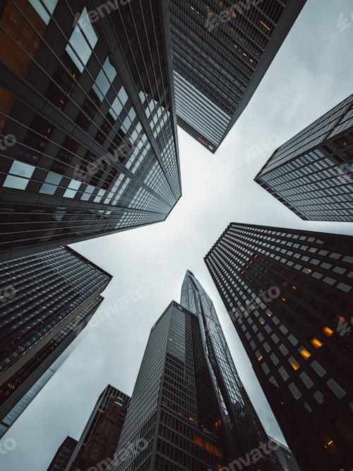 Preview: a view looking up into a group of tall buildings in the middle of the city