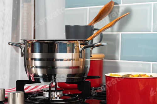 Preview: Metal pot on a gas stove burner close up
