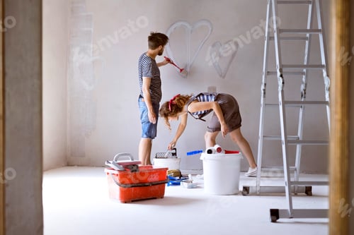 Preview: Couple painting hearts on the wall in their house.