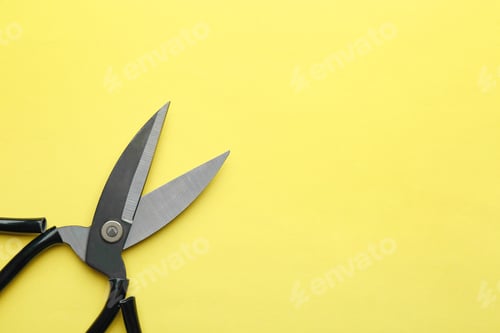 Preview: Pair of sharp scissors on color background, top view. Space for text